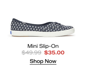 A side view of the Mini Daisy Eyelet Slip-On in navy which was $49.99 and is now $35.00 for a limited time. Shop Now.