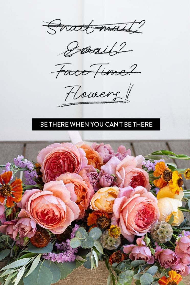 Snail mail? E-mail? FaceTime? Each crossed out. Flowers, underlined twice. Be there when you can't be there. Below, a bouquet of coral garden roses, purple statice, and orange daisies on a wood deck.