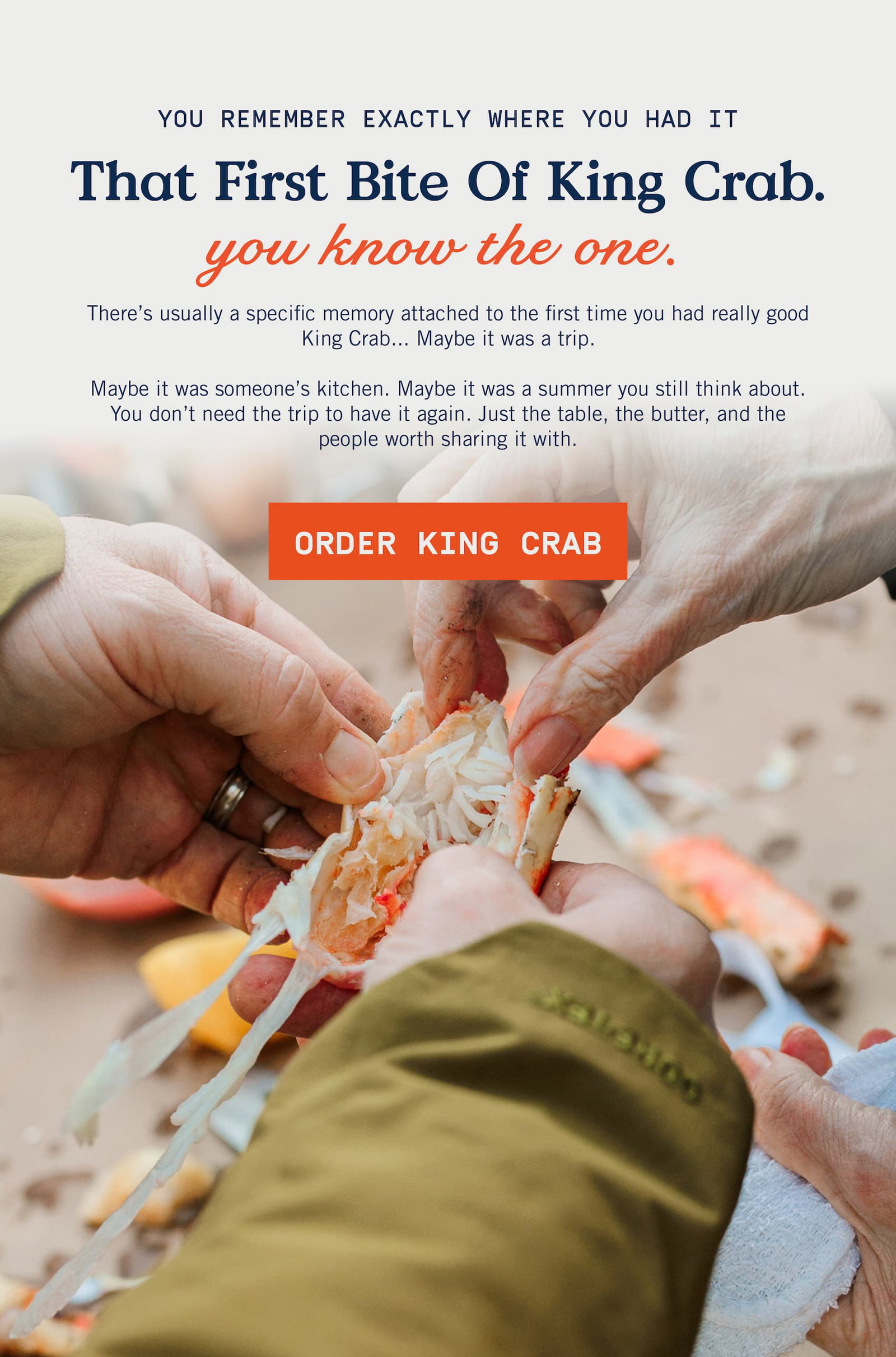 Hands reaching into shell for King Crab Legs