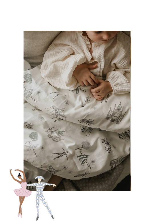 kid curled up with blanket