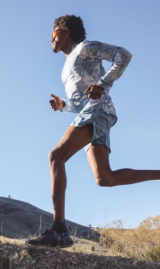 A man trail running.