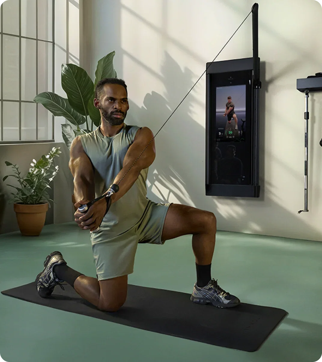 Man using the Tonal 2 Smart Home Gym at home.