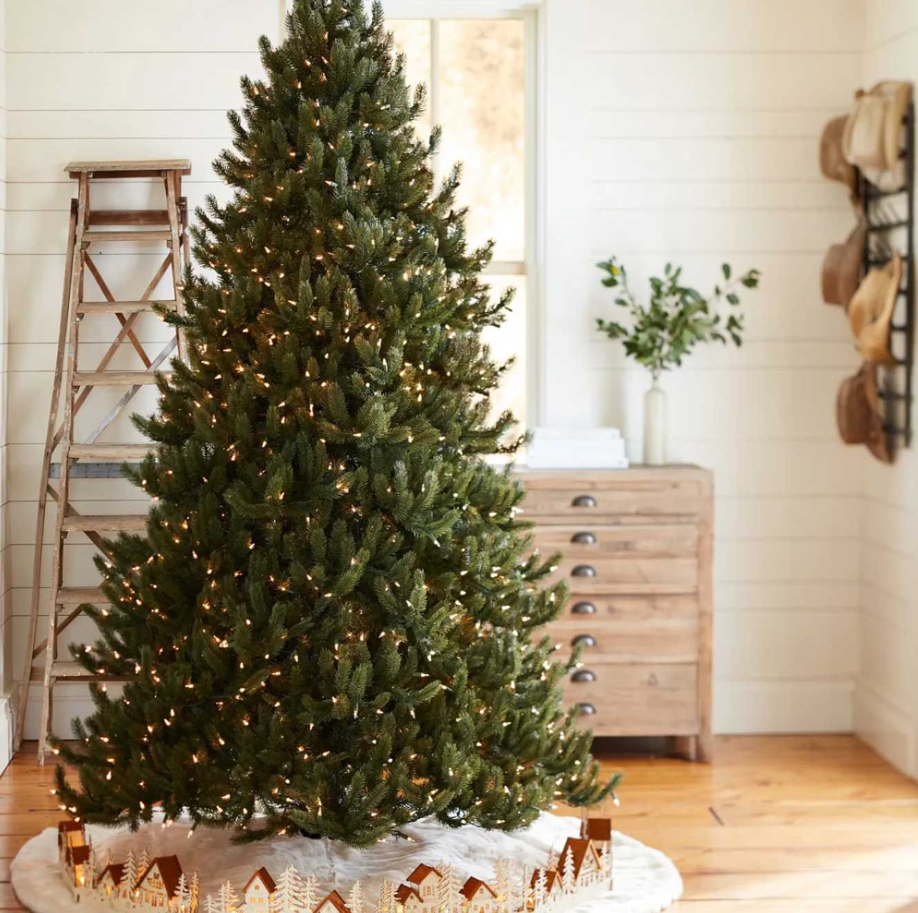 Pre-lit Vermont White Spruce tree with warm lights.