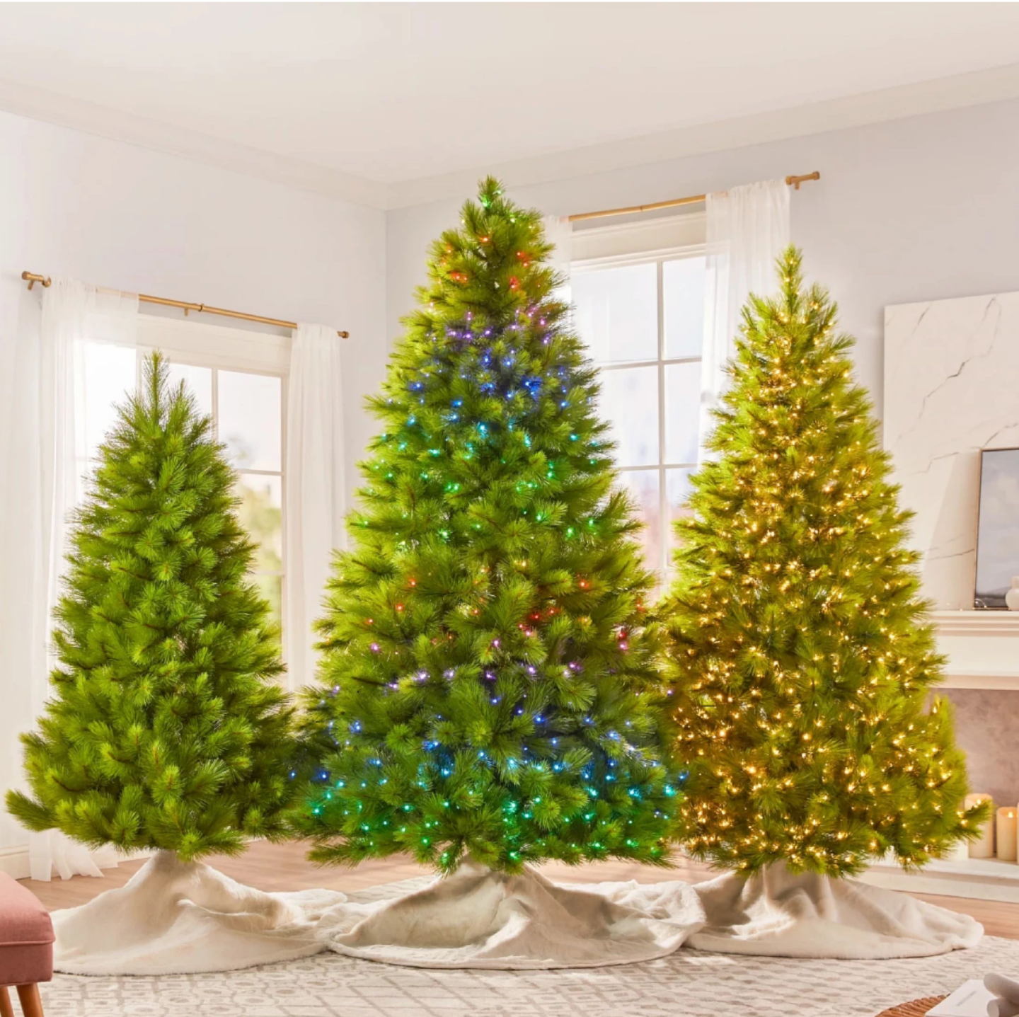 Three pre-lit Christmas trees with different lighting options.