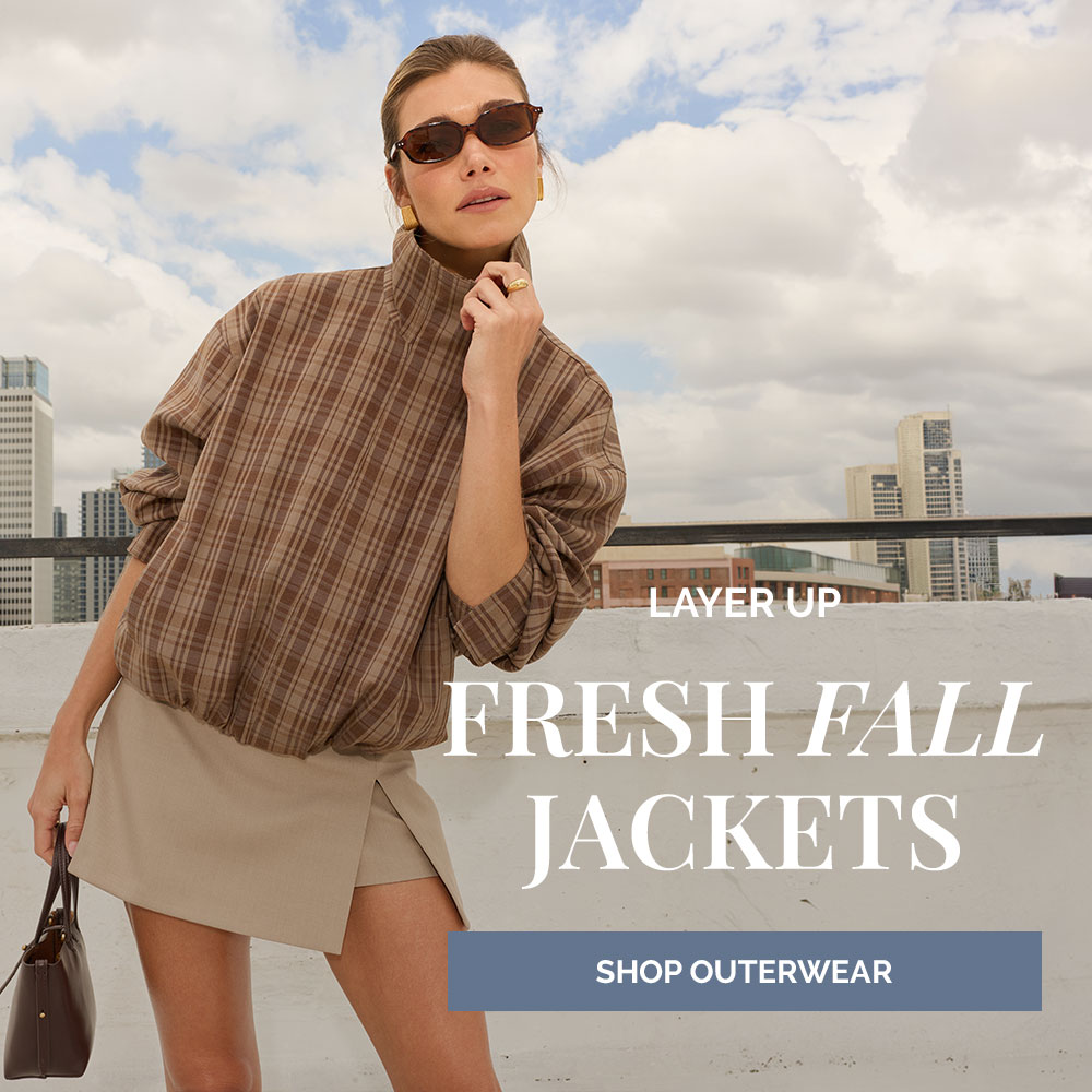 Text overlay "Layer up. Fresh fall jackets. Shop outerwear" on image