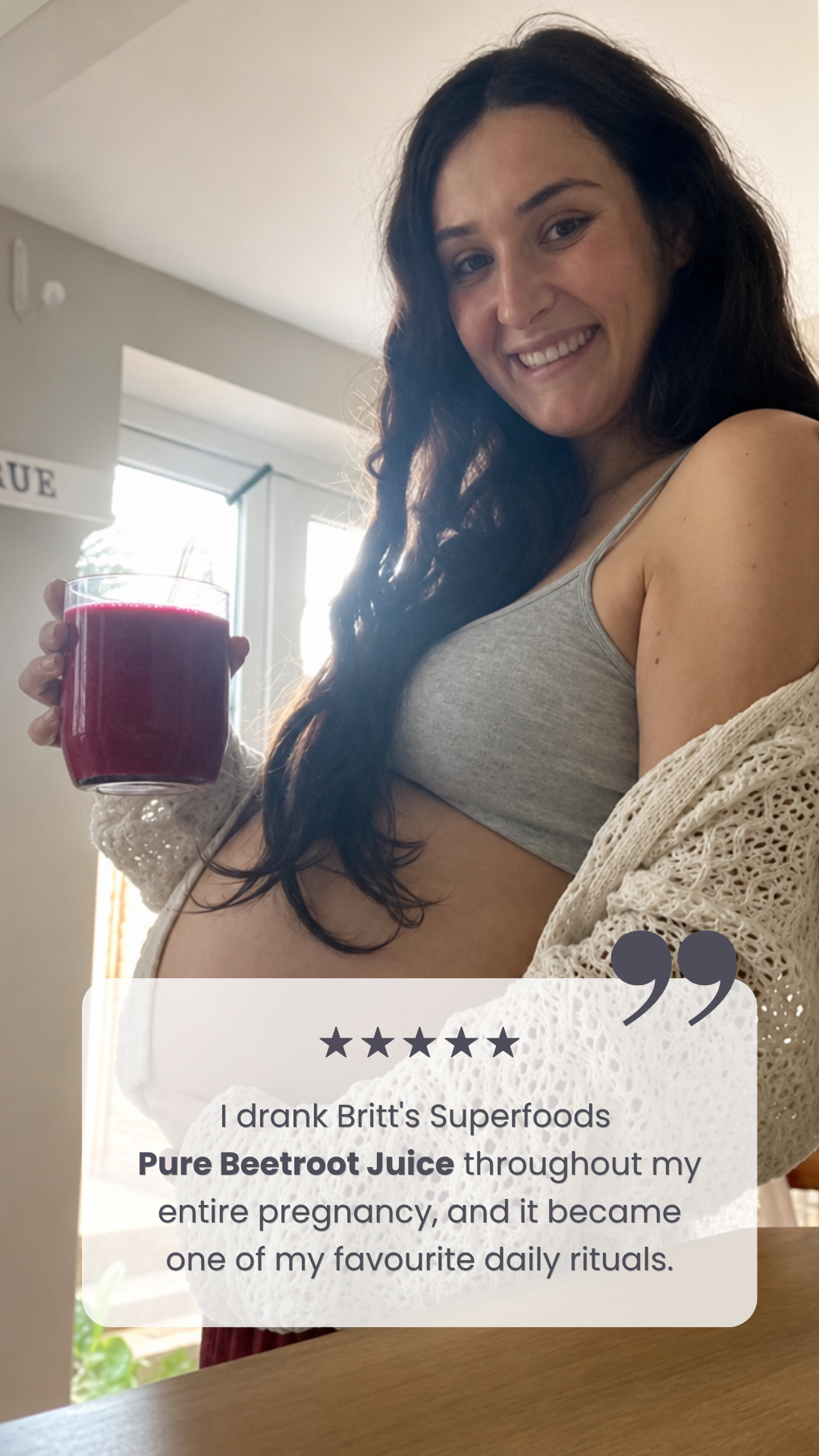 Pregnant woman holding beetroot juice