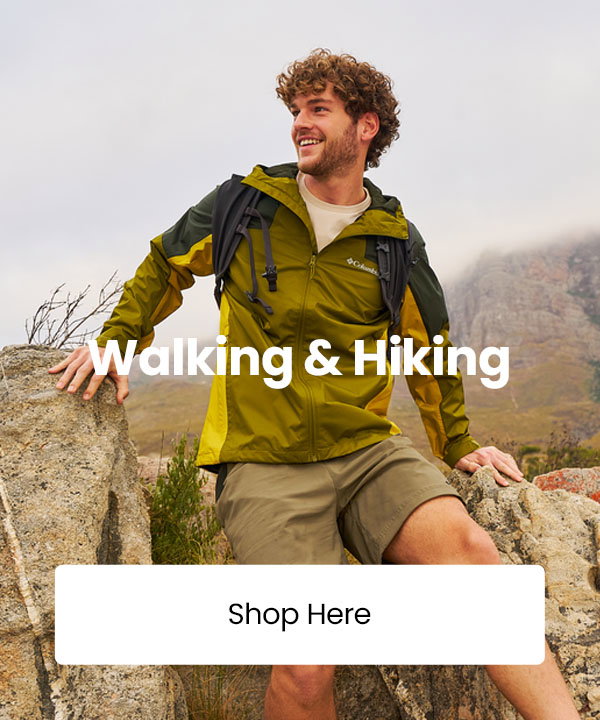 Person in outdoor hiking gear sitting on rocks in a mountain landscape with text reading “Walking & Hiking” and a “Shop Here” button.