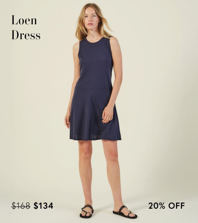 Image shows a model wearing the Loen Dress in Navy.