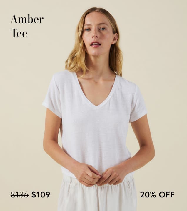 Image shows a model wearing the Amber Top in White.