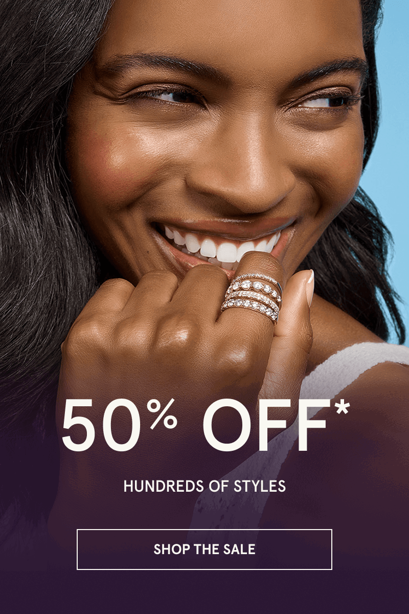 Model with various stacked diamond rings. 50% OFF Hundreds of Styles. Click here to shop the sale