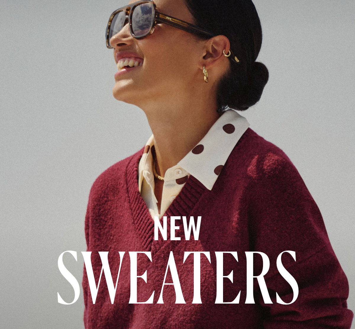 New Sweaters. Woman wearing a burdundy sweater.