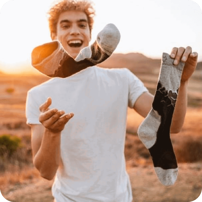 Someone holding a pair of Fox River socks