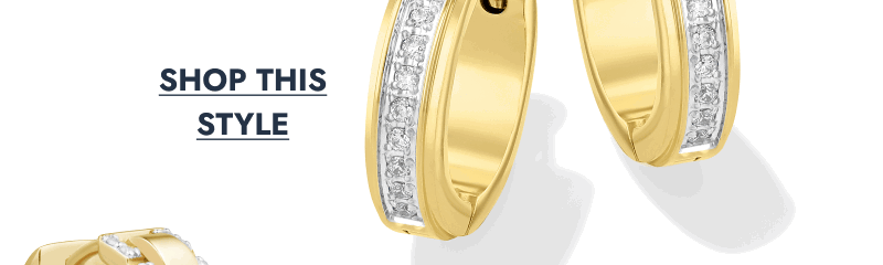 Yellow gold hoop earrings featuring a row of princess-cut diamonds in a channel setting.