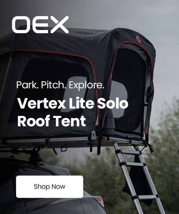 OEX Vertex Lite Solo roof tent mounted on top of a parked vehicle with an access ladder extended to the ground. Overlaid text reads “Park. Pitch. Explore.”, “Vertex Lite Solo Roof Tent” and “Shop Now”.