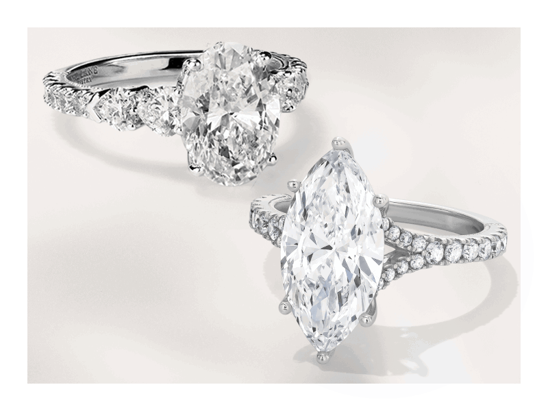 White gold oval-cut diamond engagement ring and white gold marquise-cut engagement ring.
