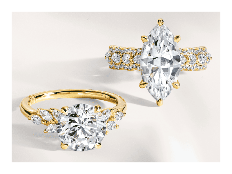 Yellow gold round solitaire engagement ring and marquise-cut engagement ring with diamond-accented bands.