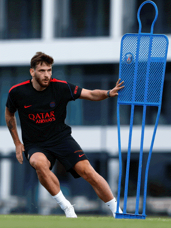 PSG player wearing the latest Nike training kit during an agility drill on the training ground.