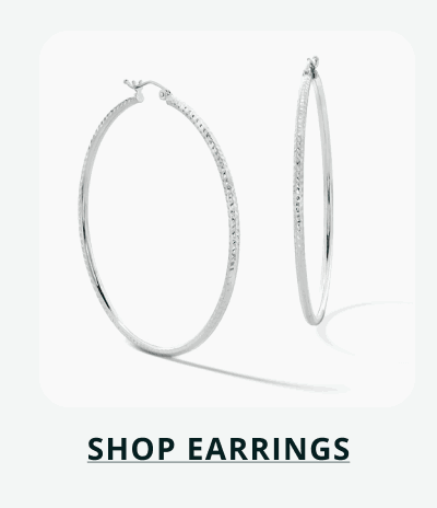 Large, textured, dainty silver hoop earrings. Click here to shop earrings.