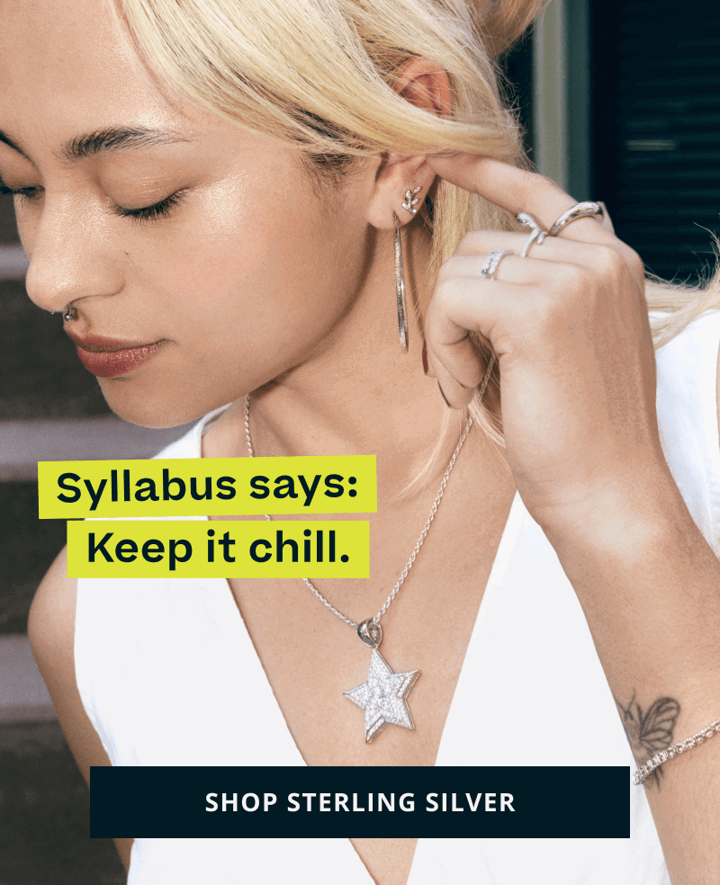 Model with silver hoops, rings & large star-shaped pendant. Keep it chill. Click here to shop sterling silver