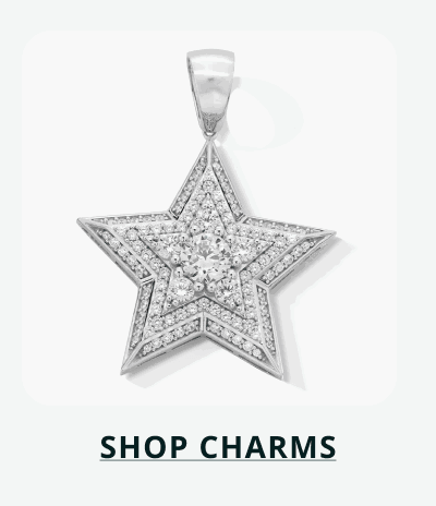 Large star-shaped charm engraved with layers of stones. Click here to shop now