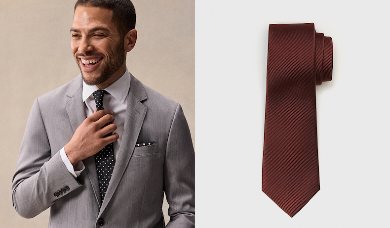 Split image. Left: a smiling man in a light gray suit adjusts his black polka-dot tie, a white pocket square with black polka-dot trim visible in his breast pocket. Right: a burgundy silk tie with a subtle diagonal weave, rolled and coiled on a light gray background.