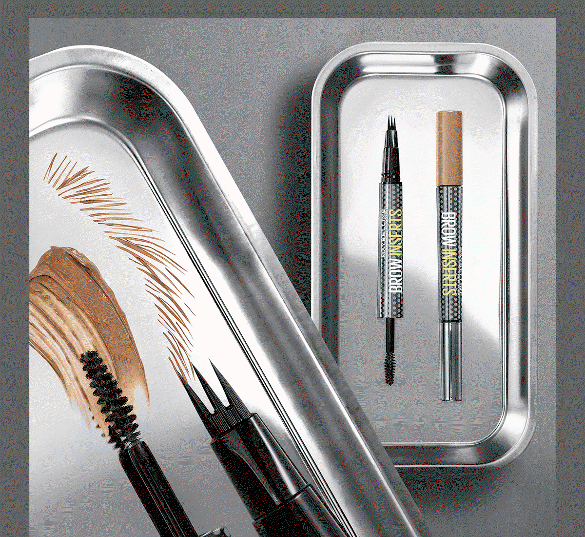 Animated product visual of Brow Inserts Multiplying Tool: dual-ended brow pen and spoolie appear in stainless-steel trays alongside hair-like brow strokes and a warm brown product swatch, illustrating defined, fuller-looking brows.