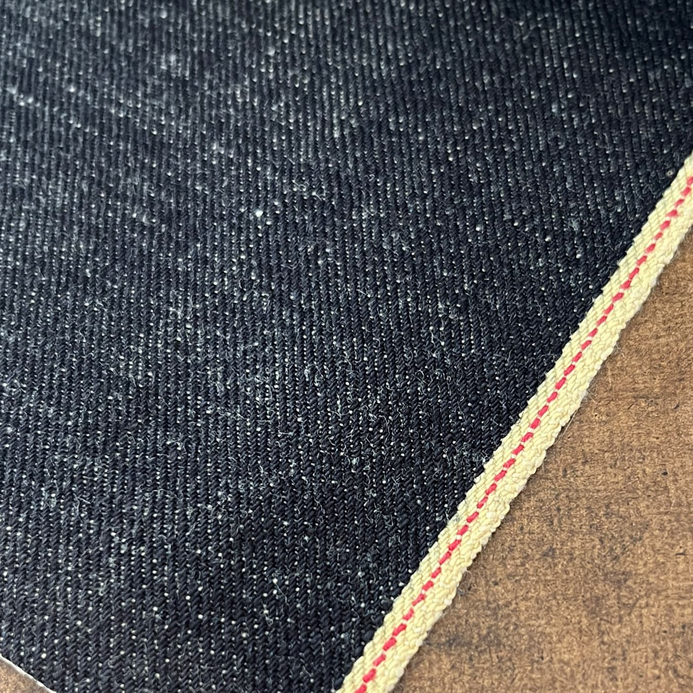 Close up detail shot showing rich texture of Selvedge Denim used on BILL BARN COAT