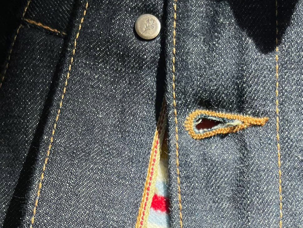 BILL BARN COAT Unbuttoned at opening showing patterned wool liner