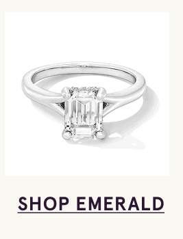 White-gold band with emerald-cut centered stone. Click here to shop emerald