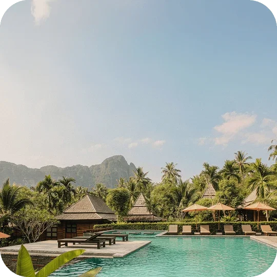 View of a pool with sun lounge chairs