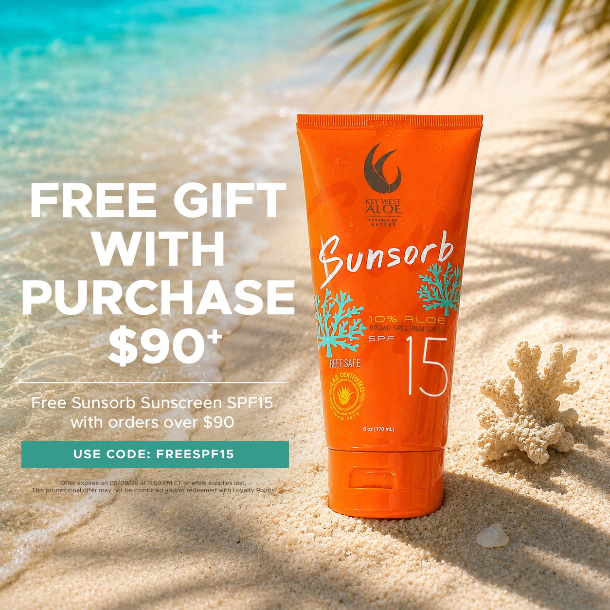a tube of Sunsorb Sunscreen SPF 15 on a beach with text that reads "Free Sunsorb Sunscreen SPF15 with orders over $90."