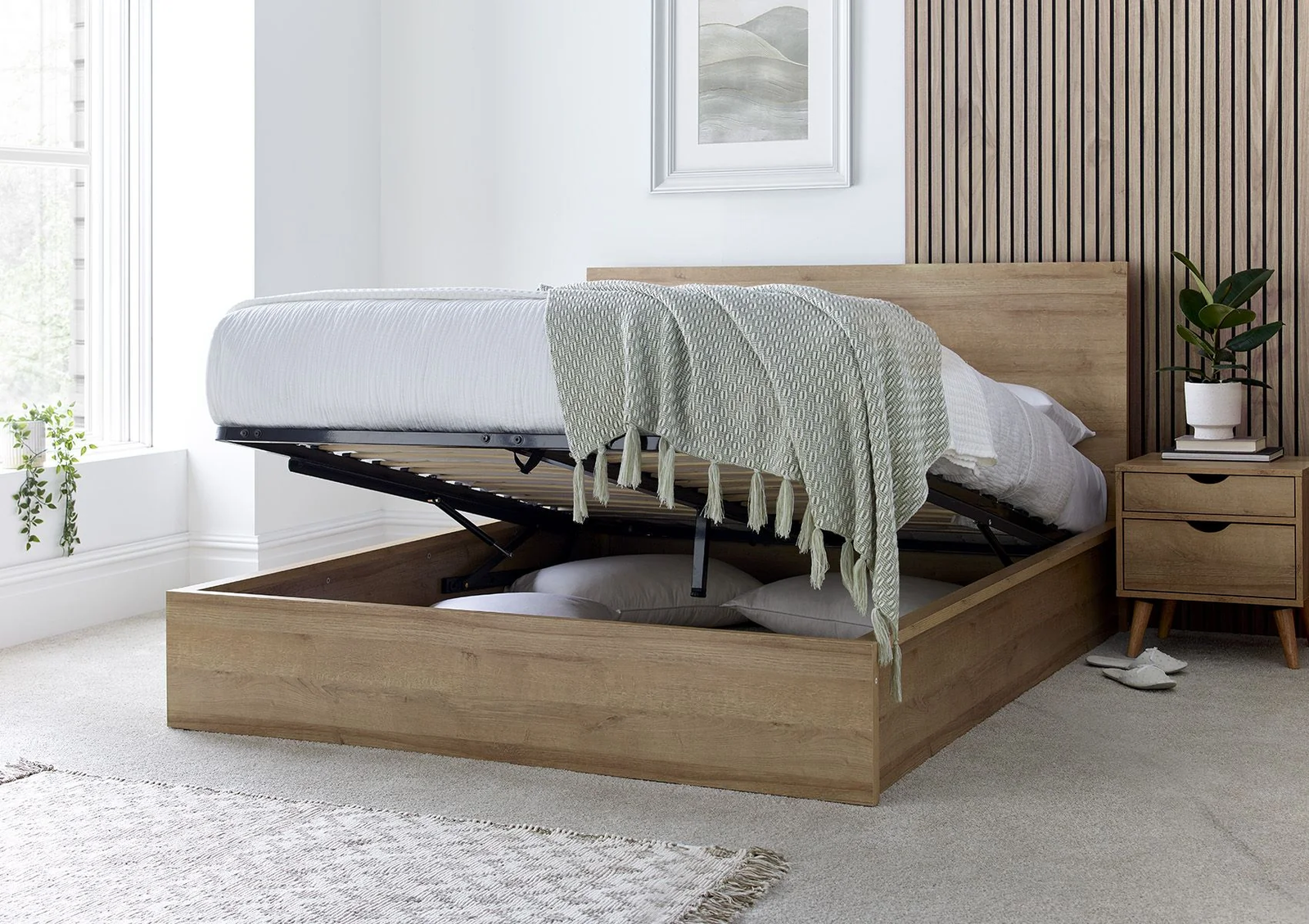 An oak wooden ottoman bed showcasing underneath storage.