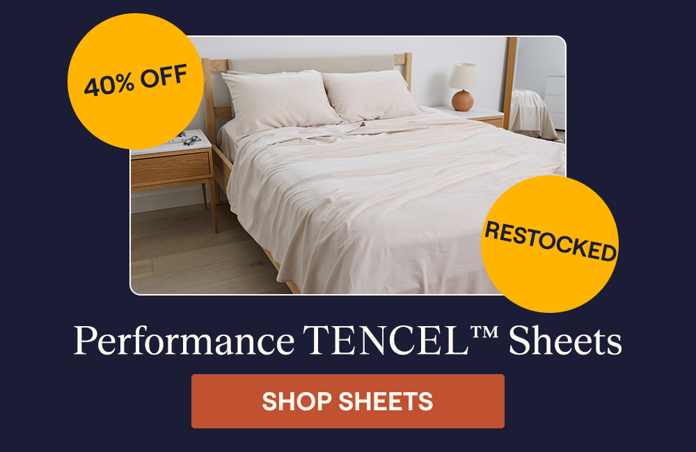 The Sand Performance TENCEL™ Sheet Set on a bed