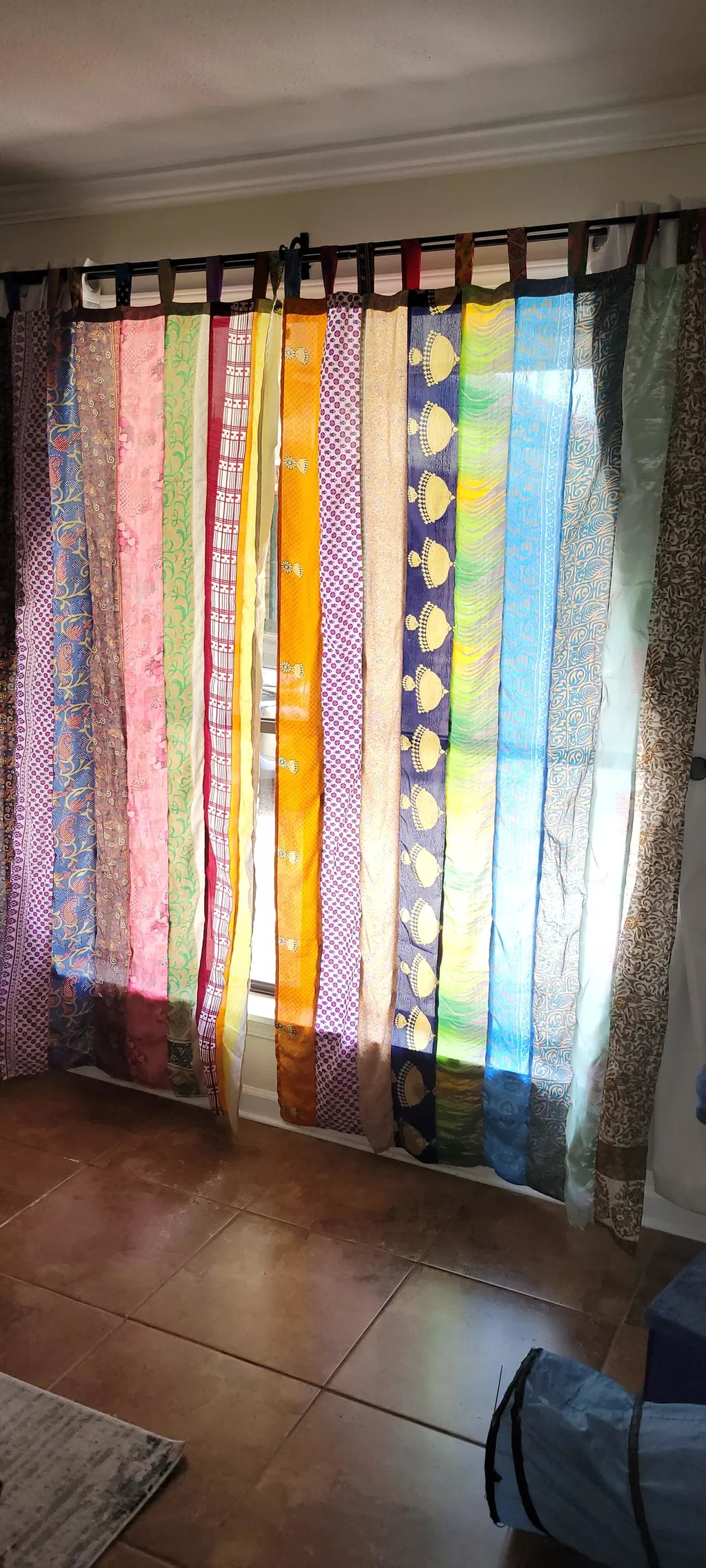 Patricia's Rainbow Oasis Drapes hung in her living room