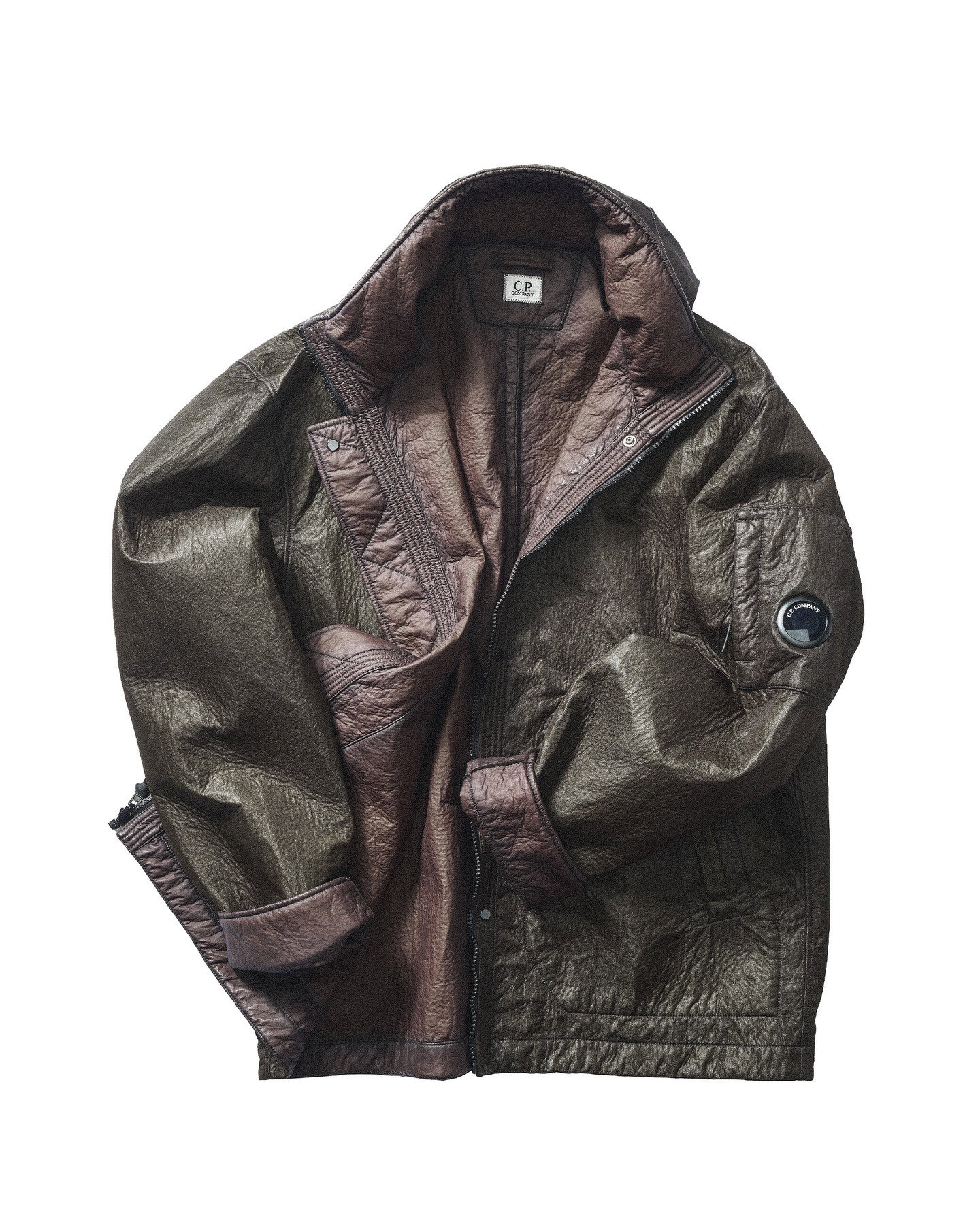 Brown leather men's jacket with quilted lining and front zip, laid flat showing cuff and circular sleeve lens detail