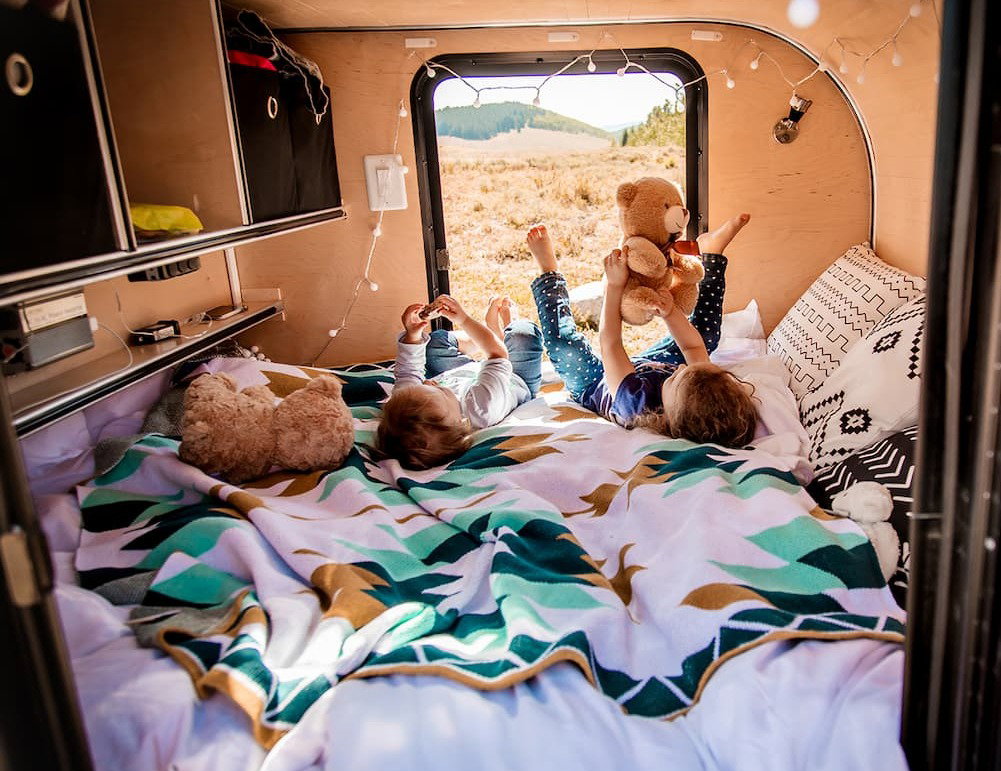 kids in a trailer with the sedona throw