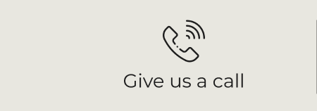 Icon of a telephone with signal lines, accompanied by the caption “Give us a dial” on a neutral background.