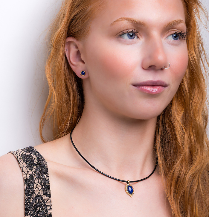 Model wearing necklace on black leather chain Vintage Inspired Oval Necklace in Silver and Lapis Lazuli