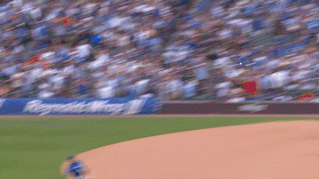 An animated gif of Ernie Clement leaping high to catch a line drive