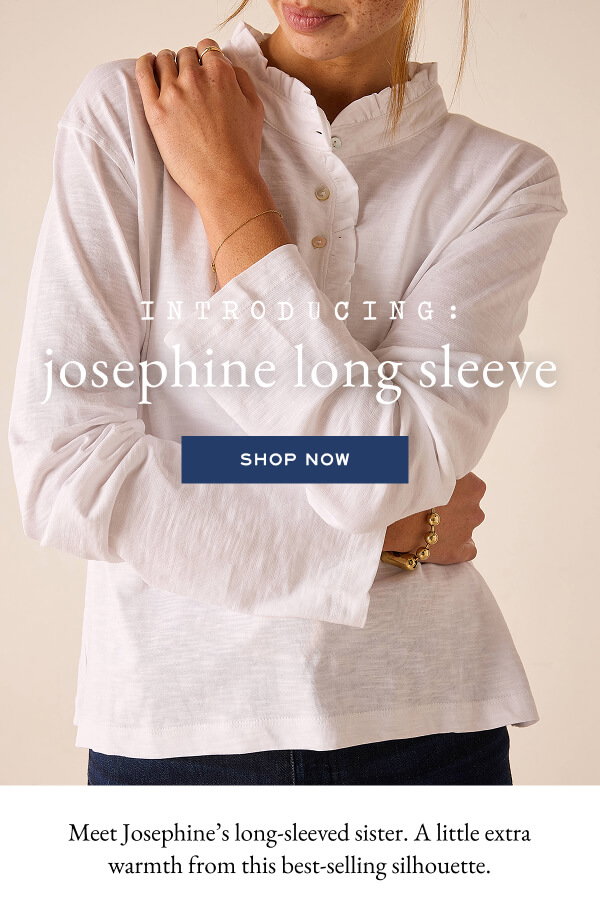 Introducing the Josephine Long Sleeve - Shop now - Meet Josephine's long-sleeved sister. A little extra warmth from this best-selling silhouette. - Close up image of a woman wearing a white long sleeve tee with ruffle details.