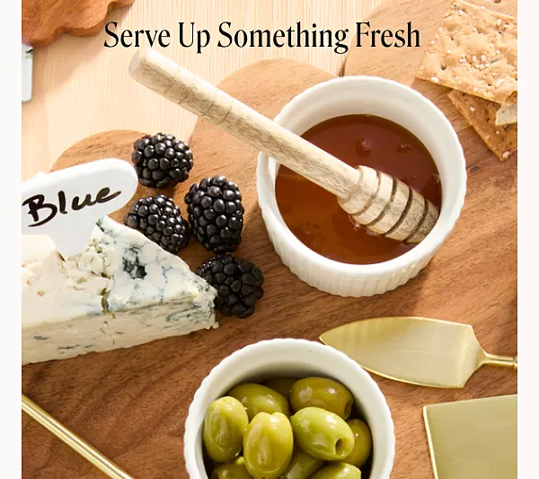 Serve up something fresh. A charcutier board on a wooden cutting board.