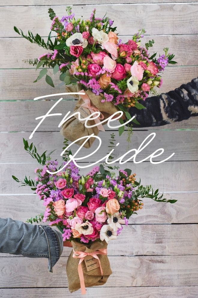 Two hands holding burlap-wrapped bouquets of bright pink and purple flowers. Text reads: Free Ride