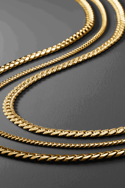Collection of yellow gold chain necklaces in curb, rope, Figaro and textured link styles.