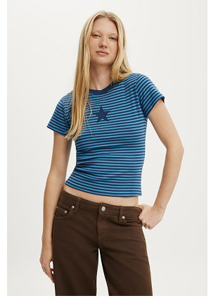 Woman wearing blue striped short-sleeve t-shirt and brown pants