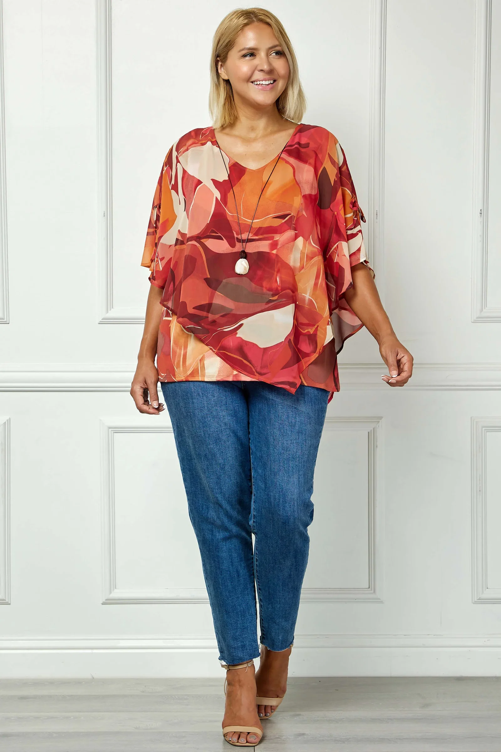 Image of Cold Shoulder V-Neck Hanky Hem Poncho Top in Ivory/Marigold/Orange - Plus