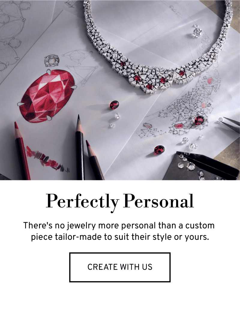 A striking diamond and ruby necklace sits on a pencil sketch. Click to Create a Custom Piece