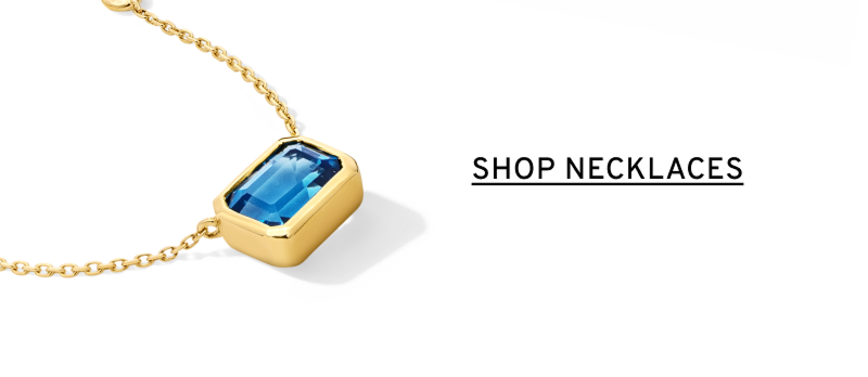 A blue stone rectangular pendant on a gold chain. Click to Shop Necklaces