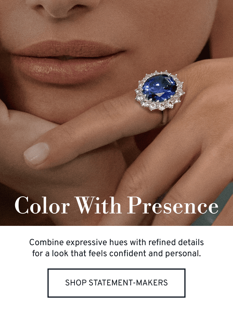 Model wearing a sapphire statement ring. Color with presence. Click to Shop Statement Jewelry