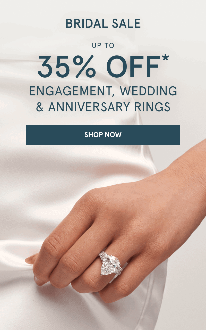 Pear-shaped diamond engagement ring with a pavé diamond band on hand. Bridal sale. Up to 35% Off rings. Click shop now.