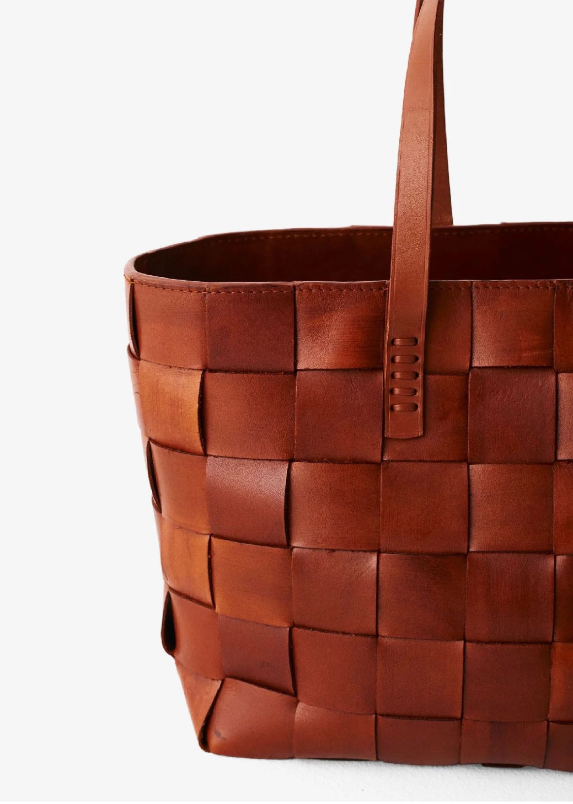 alt="woven leather tote bag"